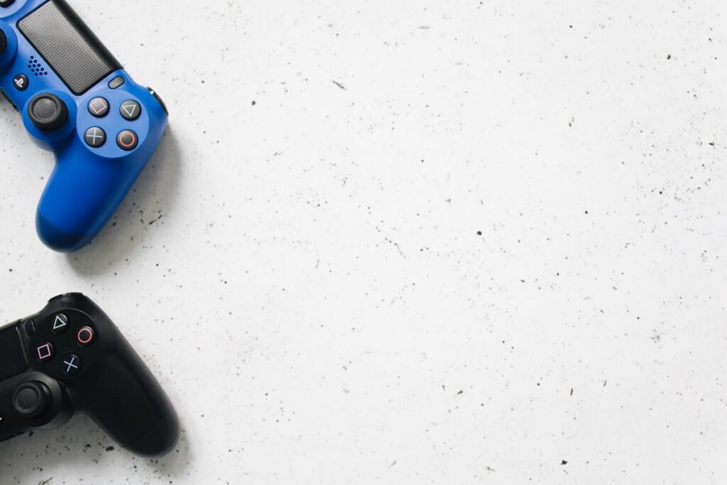 Video game controllers on a clean white surface