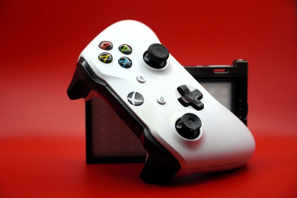 Video game controller on a bold colored background