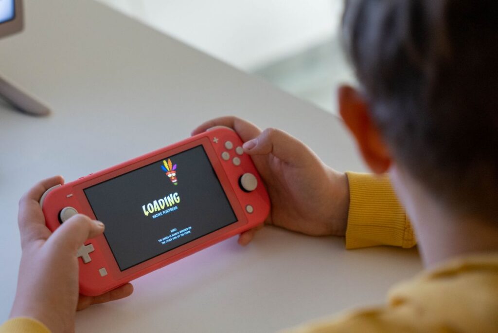 Child playing a handheld game console